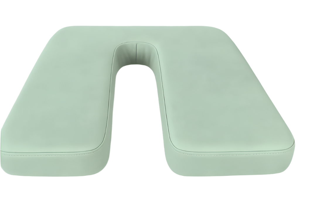 Soft sage green faux leather U-shaped cushion offering stylish therapeutic support for sitting comfort