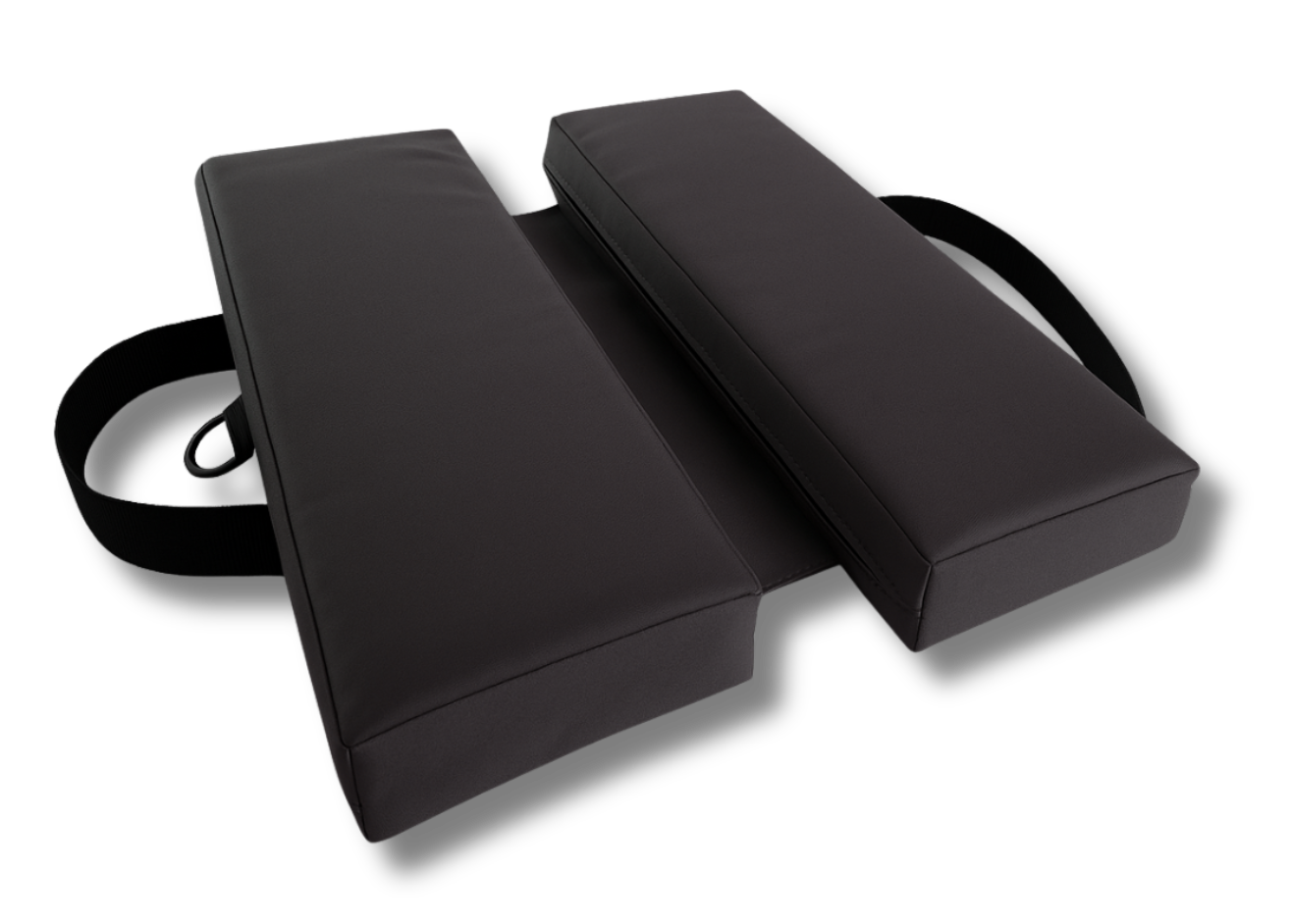 Jet black canvas travel cushion with dual foam panels and adjustable straps, water-repellent and portable design