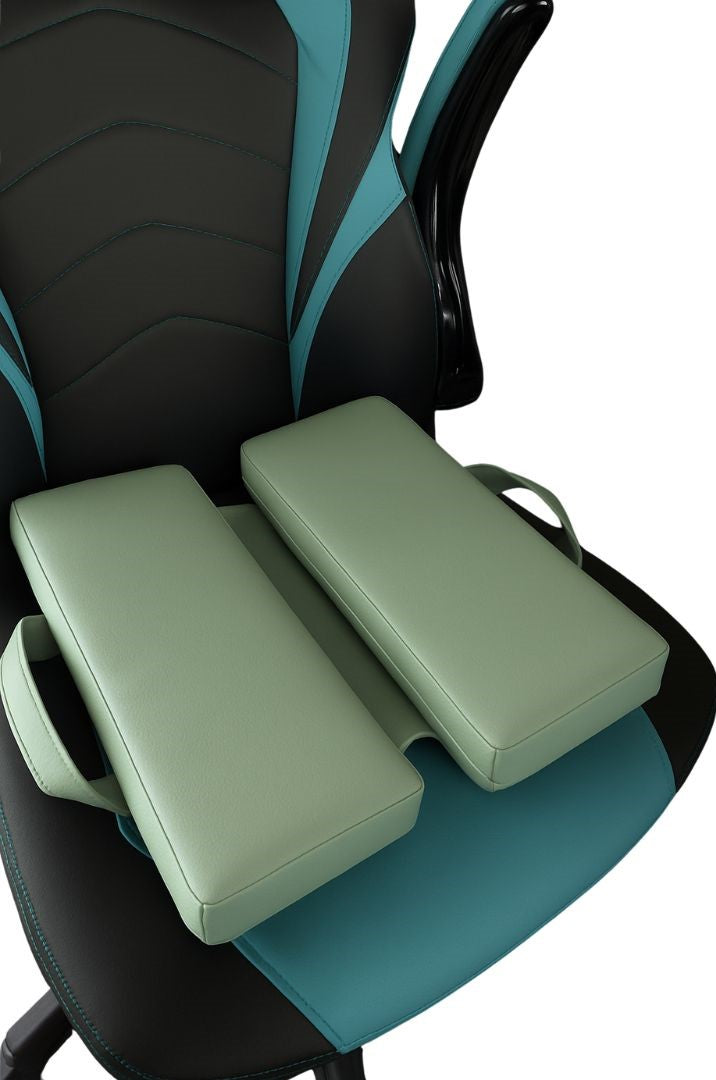 Sage green faux leather ergonomic seat cushion with handles, designed for comfort and support, displayed on a modern black and turquoise gaming chair. Ideal for home office, gaming, or long sitting sessions.