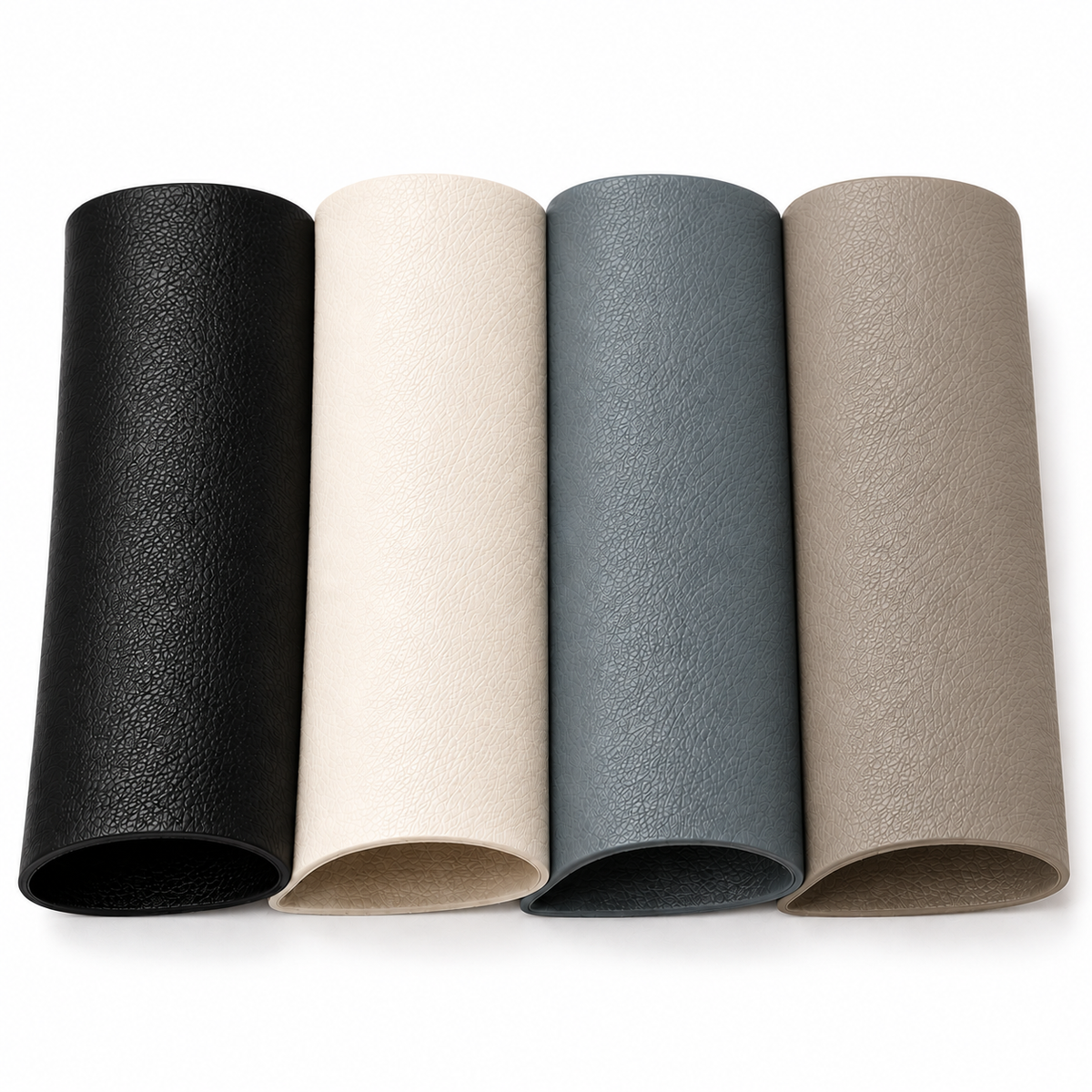 Four rolls of textured faux leather material in black, cream, slate blue, and taupe, arranged side-by-side on a white background.