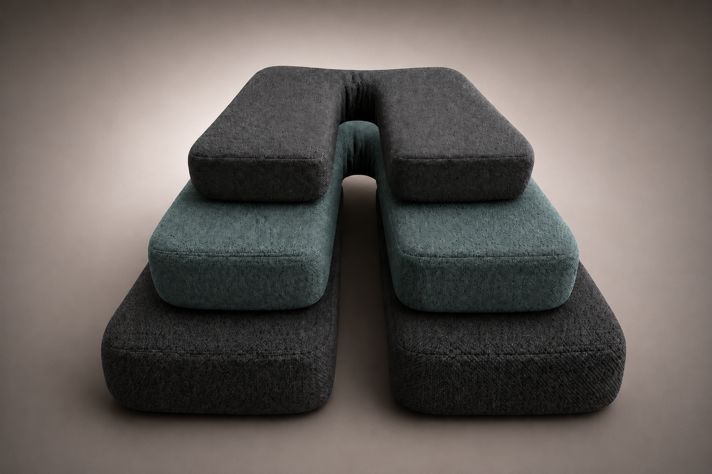 Layered SunCloud® ergonomic seating cushions displaying graduated sizing and center-channel pressure distribution design in charcoal and muted teal performance fabric against a luxury neutral gradient studio background.