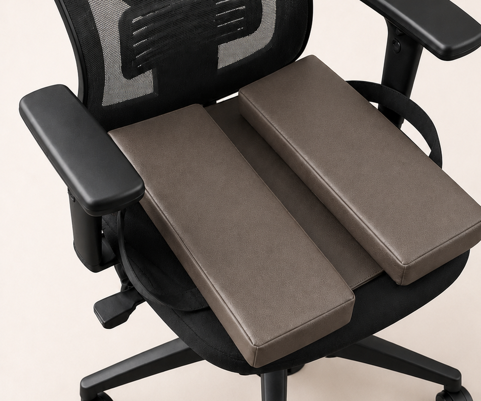 SunCloud Pebble faux leather seat cushion on an office chair with center pressure-relief channel for pelvic and tailbone comfort