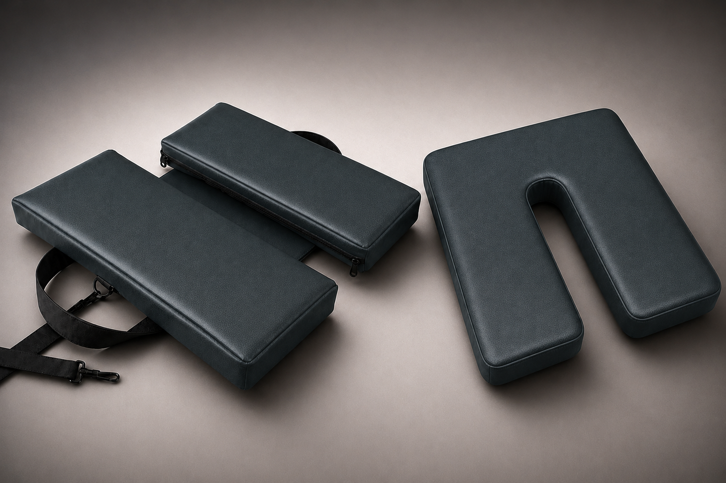 Premium SunCloud® portable comfort cushion collection featuring foldable travel support and ergonomic U-cut pressure-relief seating in deep charcoal performance material on a refined textured studio backdrop.