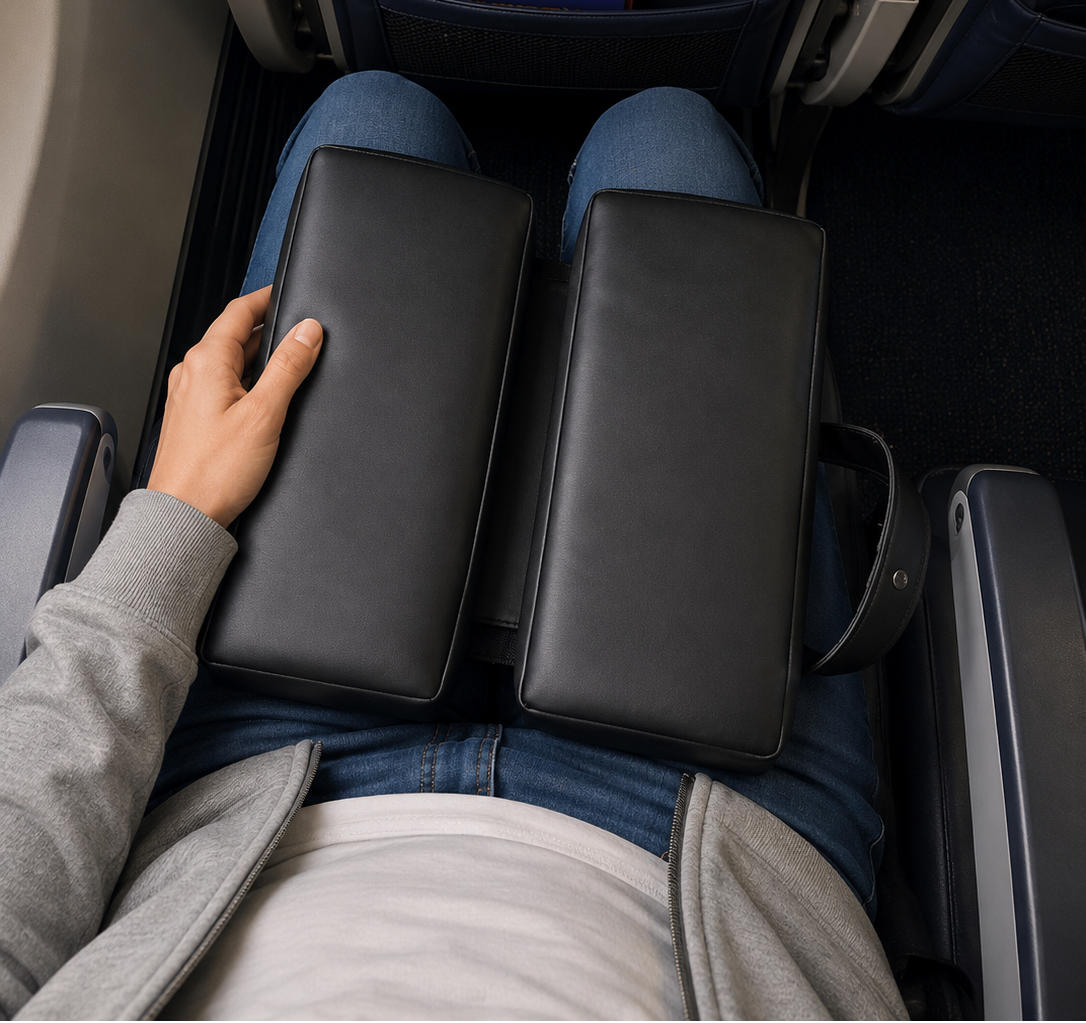 SunCloud foldable travel cushion shown in use on an airplane seat. Designed for long flights, road trips, and everyday sitting comfort with portable pressure-relieving support.