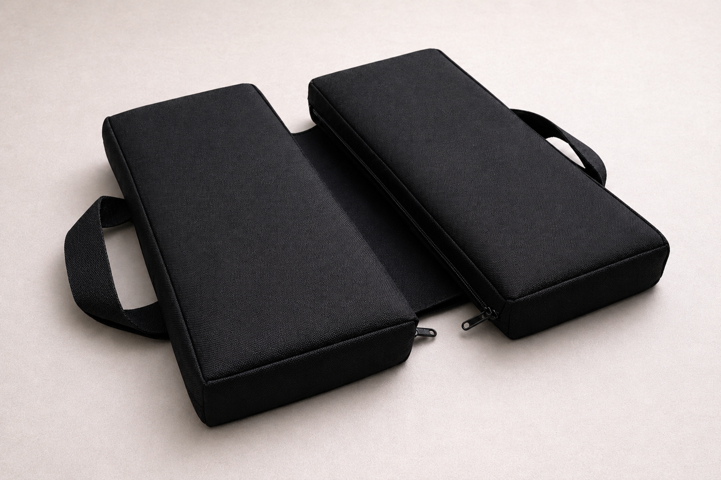 SunCloud® black canvas water repellent travel seat cushion with foldable design, providing ergonomic pelvic and tailbone support for sitting, driving, and long travel.