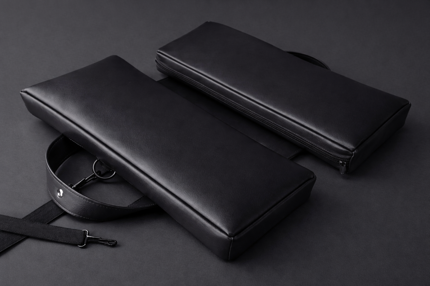 Black faux leather SunCloud® travel seat cushion with removable strap and D-ring, designed for ergonomic support at home, office, travel, and outdoor use.