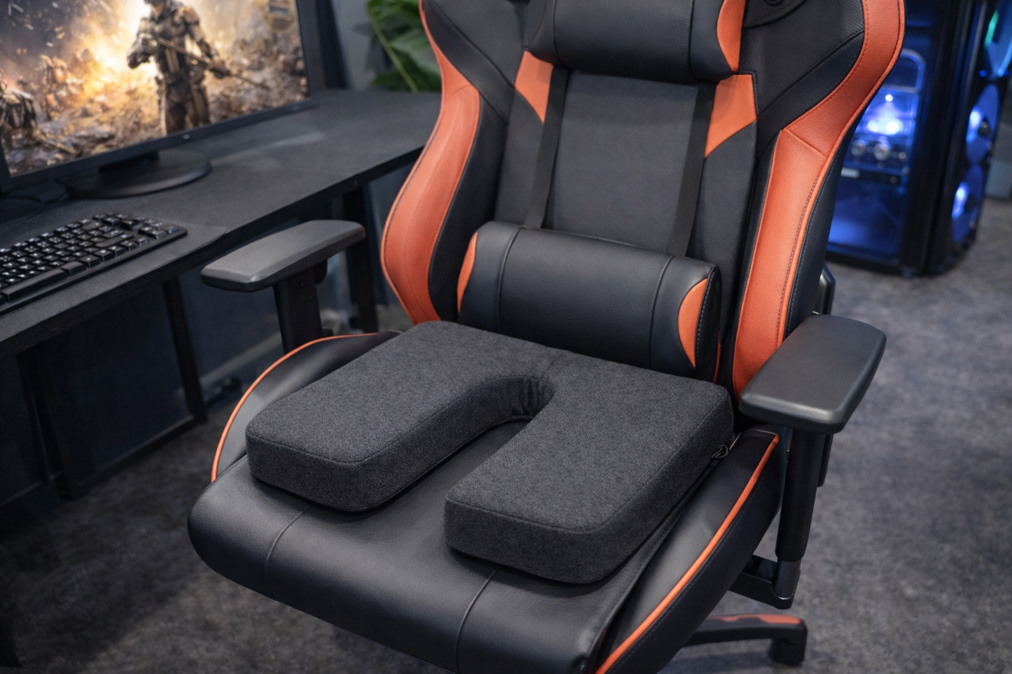 SunCloud® 2-inch U-shape coccyx seat cushion in performance fabric placed on ergonomic gaming chair for pressure relief and extended sitting comfort